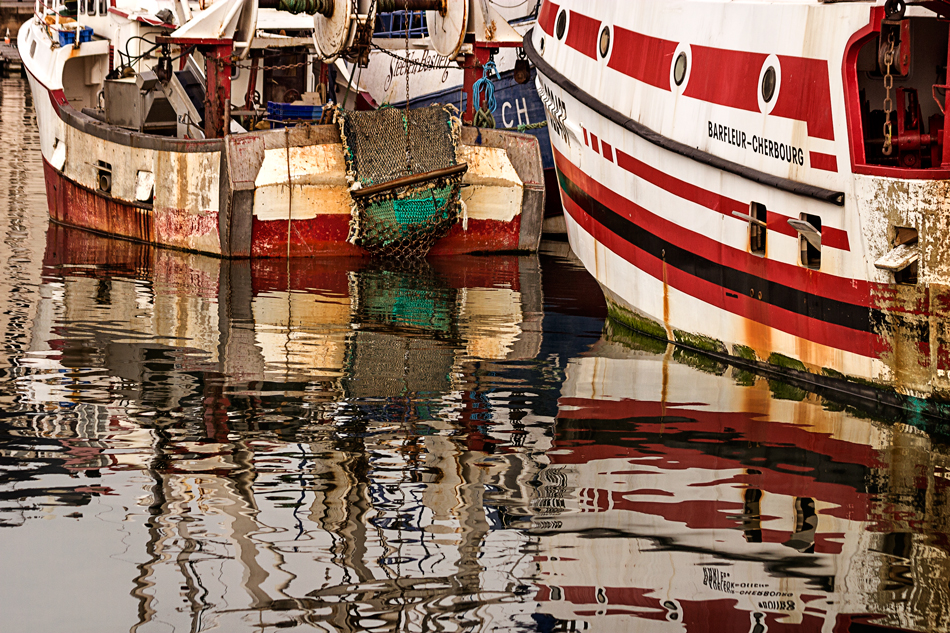 Nautical reflections were especially vibrant as the fishing boats returned shortly after sunrise. Cherbourg is a city and ferry port situated on the Cotentin Peninsula in Lower Normandy in north-western France.